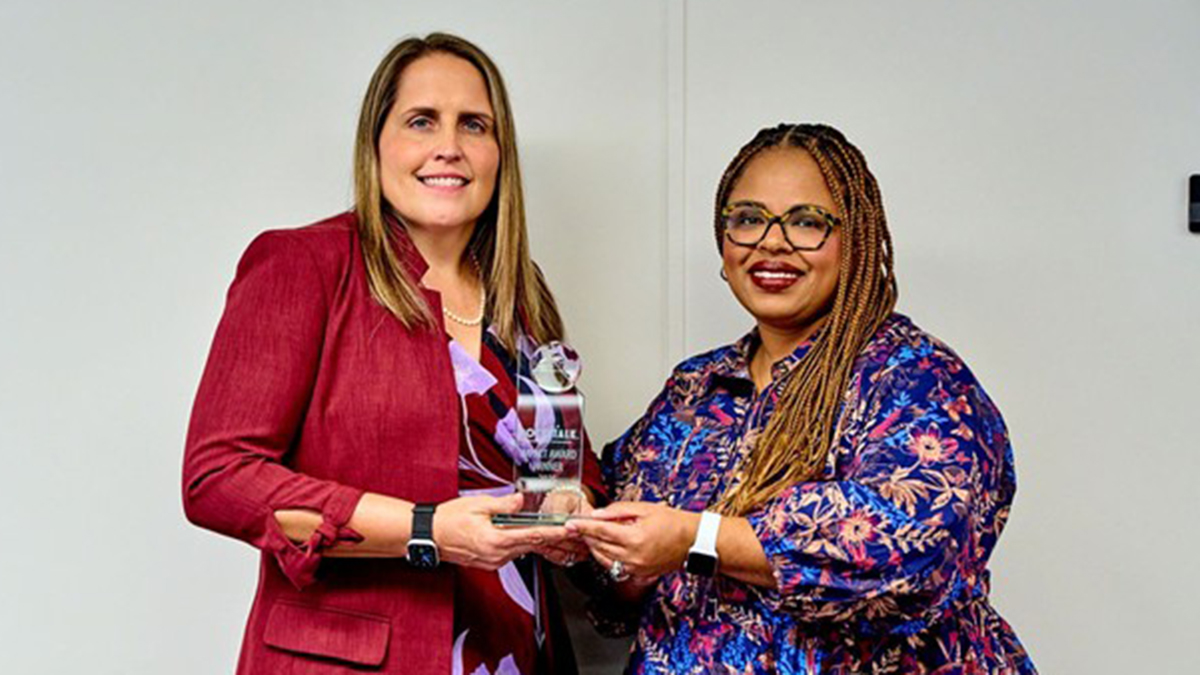 Dr.Kinney-Dr.Love-holding-award